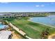 Golf course alongside lake with condos in the background at 16928 Curry Preserve Dr, Punta Gorda, FL 33982