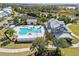 Relaxing community pool area with clubhouse and surrounding landscape at 16928 Curry Preserve Dr, Punta Gorda, FL 33982