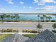 Stunning waterfront view with palm trees and calm waters at 16928 Curry Preserve Dr, Punta Gorda, FL 33982