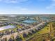 Aerial view of community with houses, lakes, and roads at 17638 Palmetto Pass Ln, Punta Gorda, FL 33982