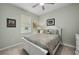 Bright bedroom with a queen bed and en-suite bathroom at 17638 Palmetto Pass Ln, Punta Gorda, FL 33982