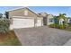 Two-story house with a paver driveway and two-car garage at 17638 Palmetto Pass Ln, Punta Gorda, FL 33982