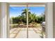 View of backyard with lush landscaping, grill, and patio at 1785 Nagorsky Ave, North Port, FL 34288