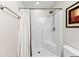 Bathroom with corner shower and a white shower curtain at 1785 Nagorsky Ave, North Port, FL 34288