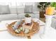 Close-up of coffee table with decorative tray, books, and candles at 1785 Nagorsky Ave, North Port, FL 34288