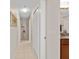 Long hallway with neutral walls and tile flooring at 1785 Nagorsky Ave, North Port, FL 34288