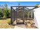 Outdoor patio area with screened enclosure at 1785 Nagorsky Ave, North Port, FL 34288