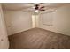 Large bedroom with carpeted floor and ceiling fan at 18085 Wintergarden Ave, Port Charlotte, FL 33948