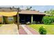 House exterior with a pergola and brick walkway at 18085 Wintergarden Ave, Port Charlotte, FL 33948