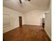 Bright living room featuring hardwood floors and a high ceiling at 18085 Wintergarden Ave, Port Charlotte, FL 33948