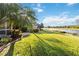 Peaceful backyard with canal view and lush grass at 1811 Scarlett Ave, North Port, FL 34289