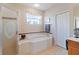 Relaxing bathroom with soaking tub and shower at 1811 Scarlett Ave, North Port, FL 34289