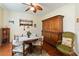 Charming dining room with a round table and antique wooden buffet at 1811 Scarlett Ave, North Port, FL 34289