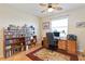 Bright home office features built-in shelving and a large desk at 1811 Scarlett Ave, North Port, FL 34289