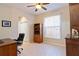 Home office with built-in shelving and a large window at 1811 Scarlett Ave, North Port, FL 34289