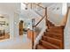 Elegant wooden staircase leading to upper level at 1811 Scarlett Ave, North Port, FL 34289