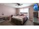 Bedroom with a queen bed, TV, and ample closet space at 183 Castile Ct, Punta Gorda, FL 33983