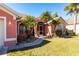 Front view of a pink house with a screened entryway at 183 Castile Ct, Punta Gorda, FL 33983