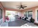 Relaxing screened porch with seating and ceiling fan at 183 Castile Ct, Punta Gorda, FL 33983