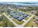 Aerial view of a waterfront community with single-Gathering homes and a shared pool at 1956 Wyoming Ave # 0, Englewood, FL 34224