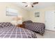 Bedroom with two twin beds featuring gray bedding at 1956 Wyoming Ave # 0, Englewood, FL 34224