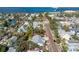 Aerial view showcasing a single-story house with a swimming pool in a residential neighborhood at 227 Harvey St, Punta Gorda, FL 33950