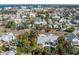 Aerial view of a home with a pool in a residential area near the water at 227 Harvey St, Punta Gorda, FL 33950