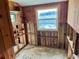 Unfinished bathroom with wood paneling and a window at 227 Harvey St, Punta Gorda, FL 33950