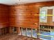 Water damaged bedroom with exposed wooden walls and floors at 227 Harvey St, Punta Gorda, FL 33950