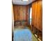 Renovation project: Entryway with exposed brick and wood paneling at 227 Harvey St, Punta Gorda, FL 33950