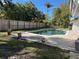 Inviting pool with brick patio and lush landscaping at 227 Harvey St, Punta Gorda, FL 33950