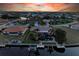 Bird's-eye view of canal-front home with pool and dock at sunset at 2358 El Cerito Ct, Punta Gorda, FL 33950