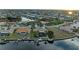 Aerial view showcasing home's waterfront location and landscaping at 2358 El Cerito Ct, Punta Gorda, FL 33950