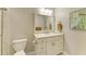 Clean bathroom with a vanity, toilet and framed art at 2358 El Cerito Ct, Punta Gorda, FL 33950