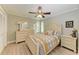 Light and airy bedroom with a queen-size bed and built-in storage at 2358 El Cerito Ct, Punta Gorda, FL 33950