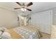 Bedroom with queen bed, white closet doors and ceiling fan at 2358 El Cerito Ct, Punta Gorda, FL 33950