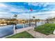 Spacious boat dock with lift and American flag at 2358 El Cerito Ct, Punta Gorda, FL 33950