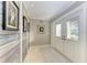 Light and airy entryway with a unique wood accent wall and tile floors at 2358 El Cerito Ct, Punta Gorda, FL 33950