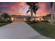 Single-story home with attached garage and mature landscaping at 2358 El Cerito Ct, Punta Gorda, FL 33950