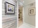 View down hallway showcasing decorative wall and access to another room at 2358 El Cerito Ct, Punta Gorda, FL 33950