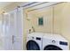 Bright laundry room with LG washer and dryer and custom closet at 2358 El Cerito Ct, Punta Gorda, FL 33950