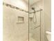 Shower with glass enclosure and tiled walls at 2358 El Cerito Ct, Punta Gorda, FL 33950