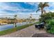 Relaxing waterfront patio with seating, overlooking the canal at 2358 El Cerito Ct, Punta Gorda, FL 33950