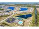 Aerial view of community amenities including pool, tennis courts, and clubhouse at 25281 E Lenox Cir, Punta Gorda, FL 33950