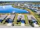 Aerial view of single Gathering home with lake view in a quiet community at 25281 E Lenox Cir, Punta Gorda, FL 33950