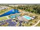 Aerial view of community amenities including pool and courts at 25281 E Lenox Cir, Punta Gorda, FL 33950