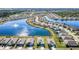 Aerial view of homes surrounding a lake in a residential community at 25281 E Lenox Cir, Punta Gorda, FL 33950