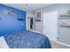 Blue-themed bedroom with a double bed, and plenty of storage at 25281 E Lenox Cir, Punta Gorda, FL 33950