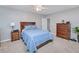 Cozy bedroom with a double bed, dresser and nightstand at 25281 E Lenox Cir, Punta Gorda, FL 33950