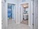 Hallway with doors to bedrooms, a bathroom, and a closet at 25281 E Lenox Cir, Punta Gorda, FL 33950